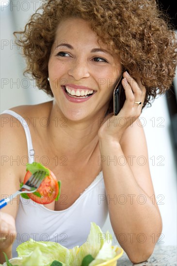 Hispanic woman talking on cell phone