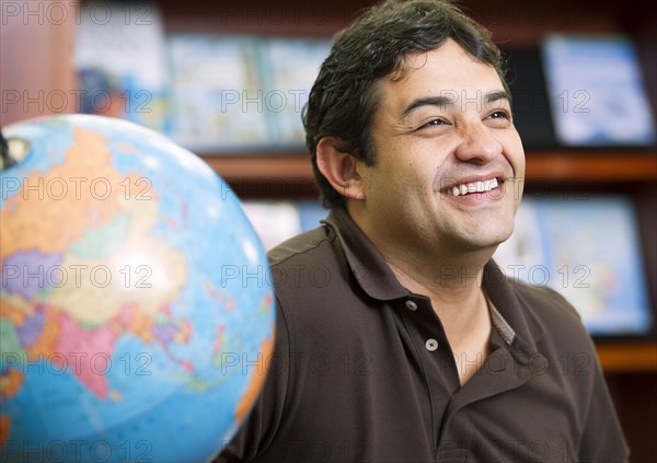 Smiling Colombian man in library