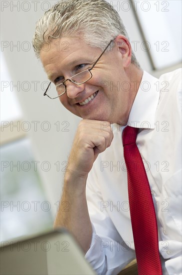 Caucasian businessman sitting at desk