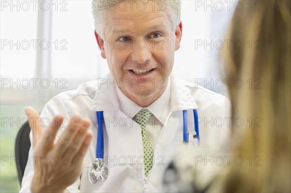 Doctor and patient talking in office