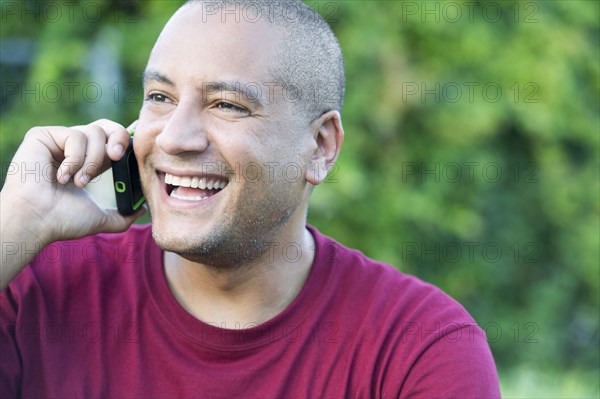 Hispanic man talking on cell phone