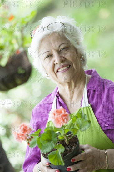 Hispanic woman gardening outdoors