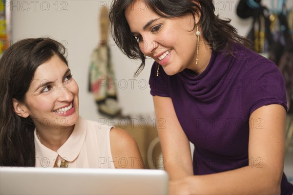 Hispanic businesswomen working together