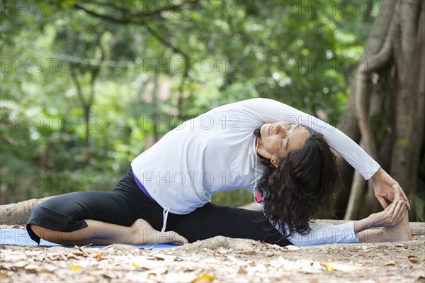 Hispanic woman practicing yoga