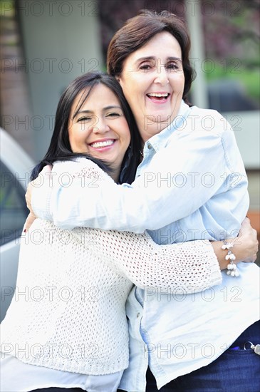 Hispanic women hugging