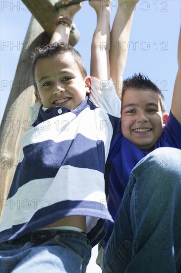 Hispanic boys playing at playground