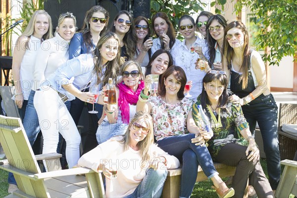 Women smiling outdoors at family reunion