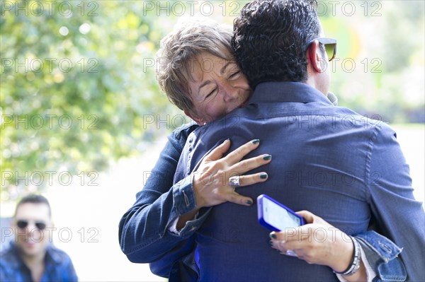 Family members hugging at reunion