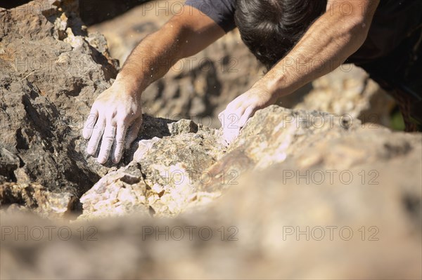 Close of up of chalk on Argentinean rock climber's hands