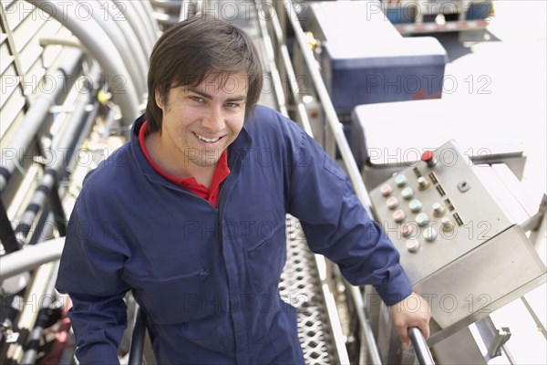 Hispanic man working in bottling factory