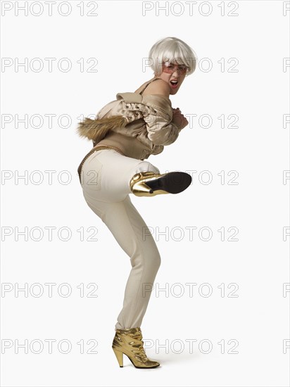 Glamorous Asian woman kicking