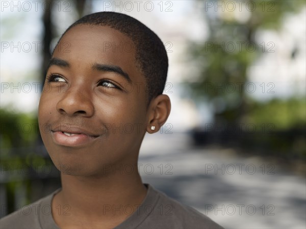 African teenage boy in urban park