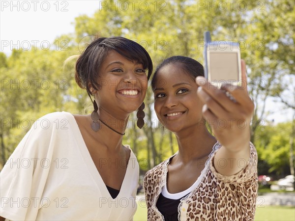 Friends taking self-portrait with cell phone