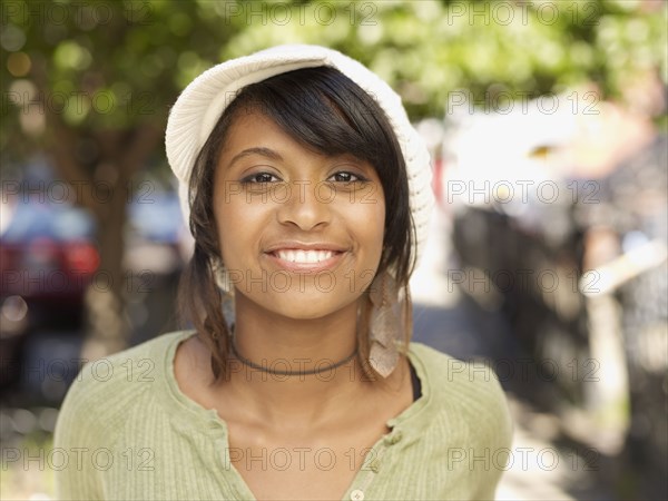 Smiling Hispanic woman outdoors