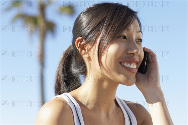 Asian woman using cell phone