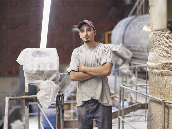 Hispanic worker in factory