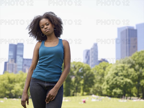 African woman standing in park