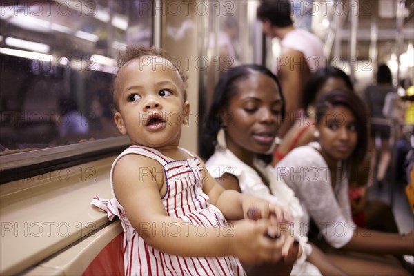 Family watching curious mixed race girl