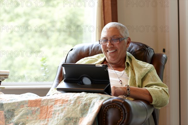 Caucasian woman using digital tablet