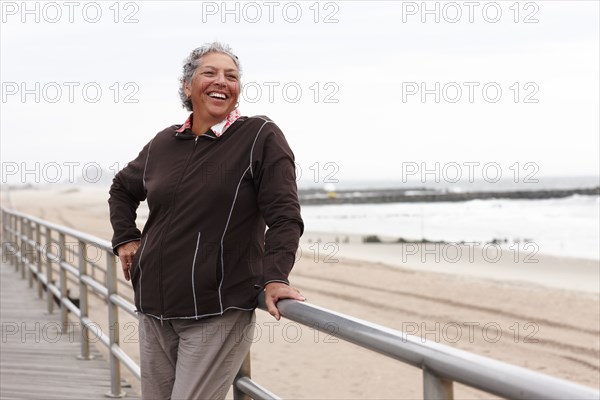 Smiling woman enjoying boardwalk