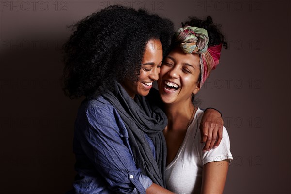 Smiling women hugging