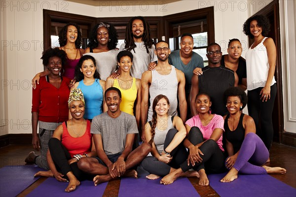 People smiling together in yoga class