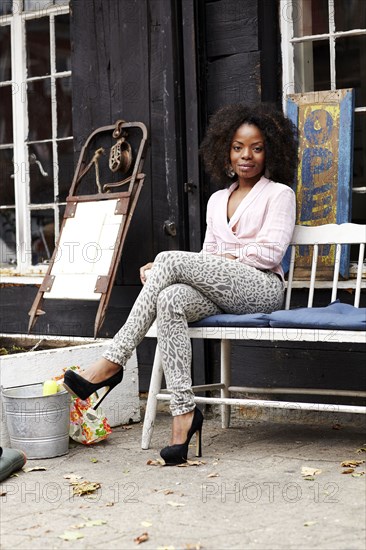 Black woman sitting on bench