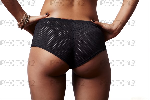 Mixed race woman wearing mesh panties