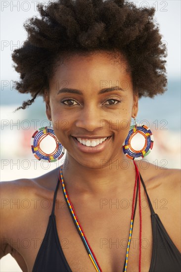 Black woman smiling on beach