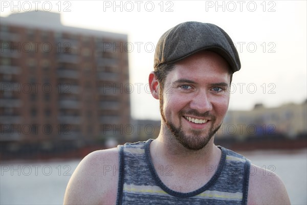 Caucasian man smiling on beach