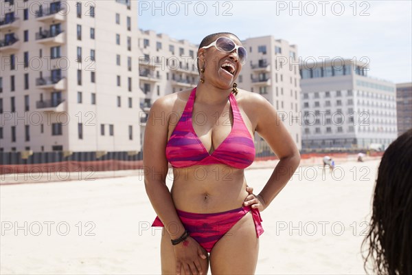 Woman laughing on beach