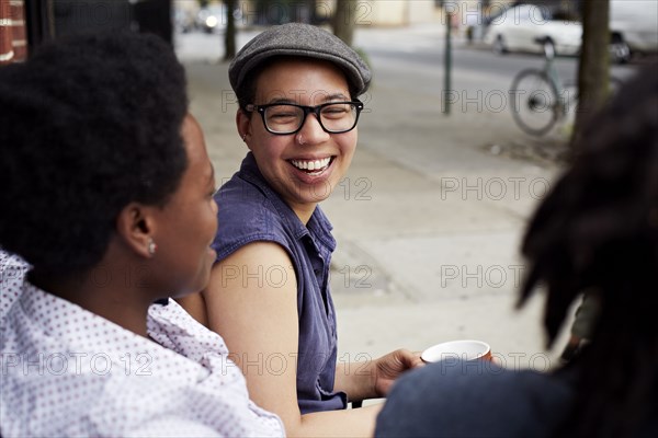 Women talking on city street