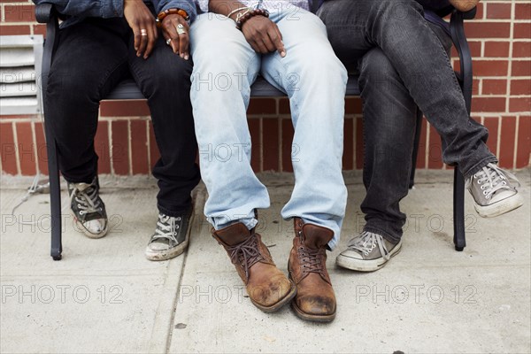 Friends' feet on city street