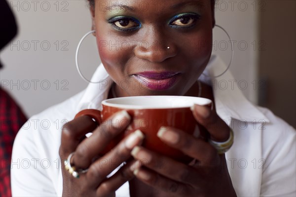 Woman having cup of coffee in cafe