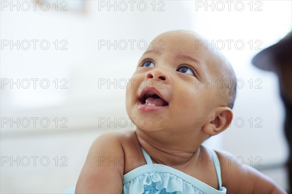 Mixed race girl looking up