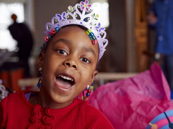 Black girl wearing tiara at party