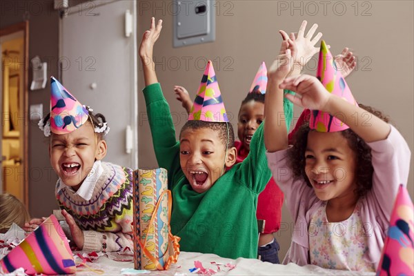Children cheering at party