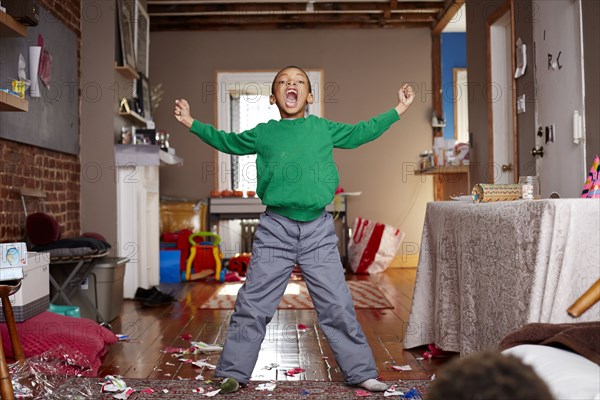 Black boy shouting in living room