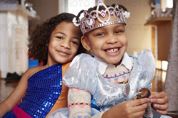 Smiling girls playing dress-up