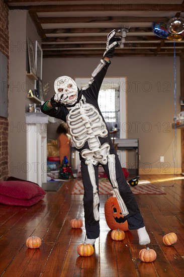 Black boy wearing skeleton Halloween costume