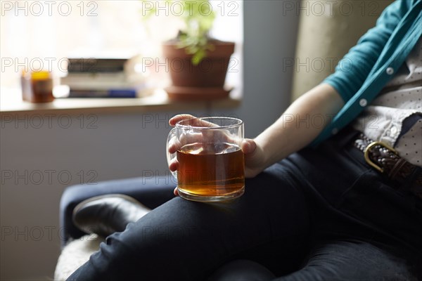 Close up of woman holding mug of tea