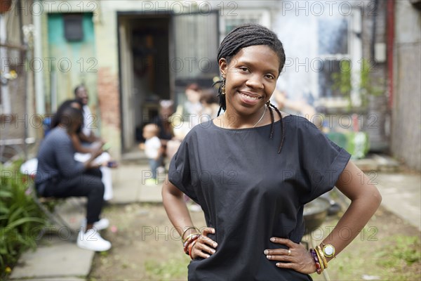 African American woman standing in backyard