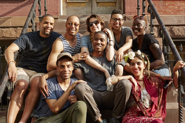 Friends smiling on front stoop