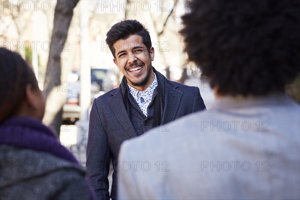 Friends laughing outdoors