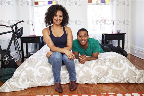 Couple smiling on bed