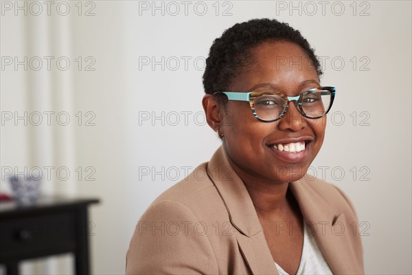 Black woman smiling indoors