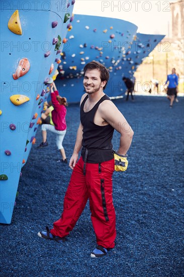 Caucasian man posing at outdoor climbing wall