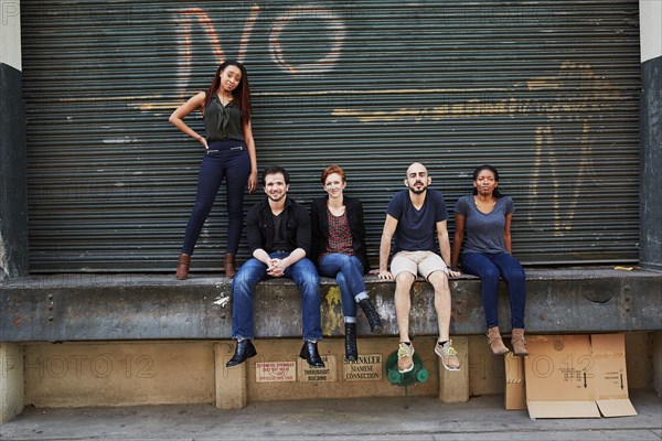 Friends posing on loading dock