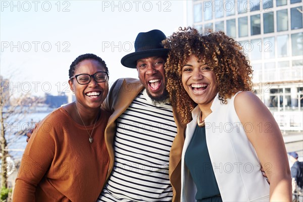 Friends smiling at waterfront