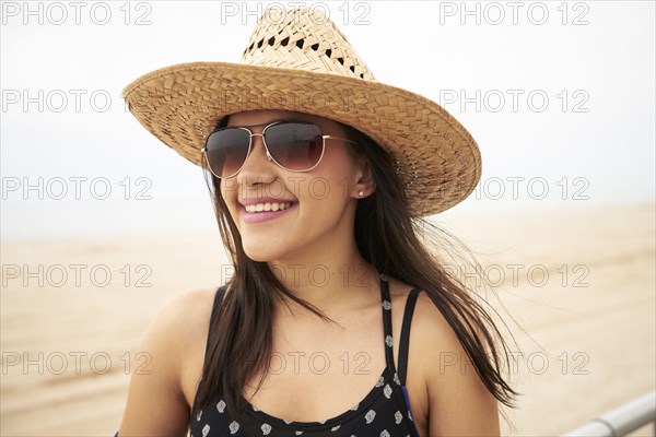 Mixed Race woman smiling on beach